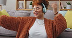 Laptop, music headphones and woman dance with energy in home for having fun, happy and smile. Computer, listening and African person in lounge streaming radio, audio or podcast sound, hip hop or jazz