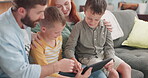 Parents, children and tablet in family home for online games, reading ebook story and educational subscription. Mom, dad and kids streaming cartoon on digital technology, media connection and lounge