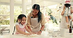 Baking, dough and a mother teaching her daughter about cooking in the kitchen of their home together. Pastry, children or family with a girl learning about from from her woman parent in the house