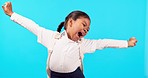 Yawn, tired and girl child in a studio stretching after school in her uniform with a backpack. Bored, exhausted and little kid model or student with a bag with a sleepy expression by blue background.