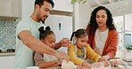 Family baking with dough together in the kitchen for dinner, supper or dessert in their home. Happy, bonding and girl children cooking with pastry with their young mother and father in their house.