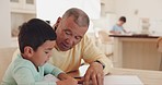 Grandfather, talking or child drawing in books for learning development together in family house. Support, homework or grandparent teaching a creative boy or artistic kid writing skills or bonding 