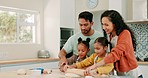 Happy, baking and kids bonding with their parents in the kitchen for dessert in their home. Love, food and girl children cooking a meal, supper or dinner with their mother and father at their house.