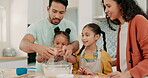 Eggs, ingredients and a family baking in the kitchen together with parents teaching their girl children about food. Help, love or bonding with kids learning how to cook from a mother and father