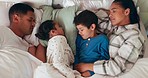 Relax, love and children sleeping with their parents in the bed for cuddling in their family house. Sweet, bonding and sibling kids taking a nap with their mother and father in their bedroom at home.