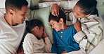 Love, bonding and kids sleeping by their parents in the bed for cuddling in their family house. Sweet, happy and sibling children taking a nap with their mother and father in their bedroom at home.