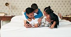 Playing, parents and children on bed with phone, bonding and fun in home on weekend morning. Mom, dad and kids in bedroom with happiness, spending playful quality time together and laugh with love.