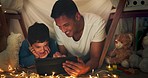 Night, father and son on tablet in tent watching movies, online games and cartoon in blanket fort. Fairy lights, family and happy dad with boy in bedroom on digital tech for bonding, relax and love