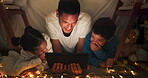 Comedy, tablet and dad with children in a tent house streaming internet video, show or movie online in the night. Dark, digital and parent or father relax with kids watching funny app in the evening