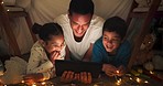 Night, father and children with a tablet, streaming movies and happiness with bonding, family and loving together. Evening, male parent and kids with technology, playful and fun with online videos