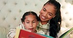 Reading, mother and daughter in bedroom with book, teaching and happy learning time in family home. Knowledge, fantasy and storytelling, mom and child relax on bed together with love, care and story.