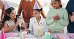 Birthday, girl and people clapping hands at the party to blow candles on her cake in the garden. Happiness, smile and excited young child and group of family in celebration at outdoor event together.