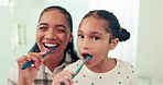 Brushing teeth, mother and daughter with toothbrush and dental for health, morning routine and happy face. Healthy, hygiene and portrait, woman and young girl, oral care and cleaning mouth at home