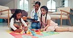 Girl children, psychology and playing with toys, sisters and doctor on floor, consulting and checklist for notes. Woman, female kids and therapy with clipboard, paperwork and writing for progress