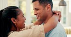 Dance, face and a happy couple embrace at home with love, care and romance. Young woman and a man laughing together in an apartment to hug and bond for happiness, quality time and commitment