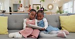 Black girl children, relax with tablet on sofa and elearning or watching cartoon movie, sisters at home and screen time. Young female kids, streaming online and subscription to education app or film