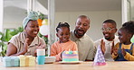 Birthday, children party and clapping with a black family in celebration of a girl child in their home. Parents, grandparents and applause with kids blowing candles on a cake at a milestone event