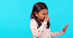 Stink, smell and a girl holding her nose in studio isolated on a blue background while waving away a bad scent. Children, toxic fragrance and nausea with a young kid blocking an unpleasant aroma