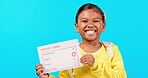 Report card, face and girl with success in studio with presentation of grades, academic achievement or education. School, student or Indian child show results with happiness on a studio background