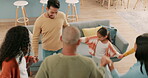 Family, children and dance with a group of people in the living room of a home together playing a game. Kids, fun in a circle or carefree with parents, friends and relatives moving while bonding