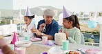 Family, children laugh and grandfather with cake on patio with party horn and celebration. Blowing, young kids and old man with a smile ready to celebrate with youth, food and happy birthday event