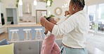 Excited mom, child and dancing in living room with happiness, energy and bonding in home together. Black family, mother and daughter dance on sofa, music and quality time for woman and little girl.