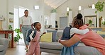 Father, family hug and student after school with love and support in a home feeling happy. House, living room and dad with children and youth with smile and young kids with papa and parent care