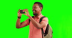 Green screen, phone and black man taking picture or photo of travel journey for social media, online or internet. Adventure, smartphone and happy young person or influencer explore with mobile camera