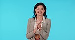 Business woman, clapping and celebrate win or success on a blue background with a smile. Female entrepreneur excited or applause emoji in studio for achievement, deal or promotion and announcement