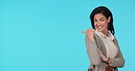 Face, business woman or advertising mockup space in studio, blue background and promotion deal. Portrait, smile and female worker pointing to presentation of launch, opportunity and offer information