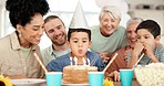 Child with birthday cake, candles and happy family celebrate with excited applause together in home. Happiness, celebration and congratulations, people at kids party with love and children in kitchen