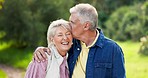 Face, kiss and senior couple in nature, having fun and bonding together. Portrait, happy and elderly man and woman smooch, laughing at funny comedy and enjoying quality time outdoor on love vacation.