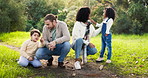 Family, learning and children are bonding in outdoor for adventure or quality time with love. Parents, showing and kid at park with mom or dad for childhood development or relationship on holiday.