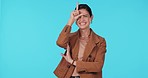 Face, funny and woman with loser sign, review and laughing against a blue studio background. Portrait, female person or model with happiness, symbol of comedy and playing with emoji, smile or opinion