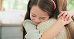 Love, mom and girl hug with a smile or bonding, support and child care for mama with happiness in home, house or kitchen. Hugging, mother and daughter with happy embrace and quality time together