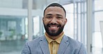 Happy, confidence and face of a young businessman standing in the office with legal success. Happiness, smile and headshot portrait of a handsome professional male corporate lawyer in the workplace.