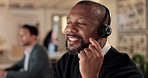 Call center, black man and communication of consultant for customer service, contact us or working late at computer. Male telemarketing agent consulting at desktop for CRM questions, sales or support