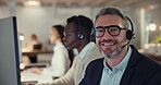 Call center, man and face of consultant with smile for customer service, contact us and working late. Portrait, happy team and telemarketing agent consulting at help desk for CRM in coworking office