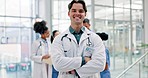 Man, doctor and arms crossed in pride for healthcare, surgery or leadership at the hospital. Portrait of happy and confident male person or medical professional in health or team management at clinic