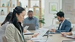 Business woman, meeting and statistics notes for finance analysis in a office. Conference room, Asian female person and reading a budget review and accounting report with staff for a project