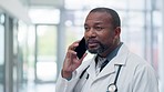 Black man, doctor and talk on phone call with medical consultation in a hospital for healthcare. Clinic, networking and smile from a wellness professional with communication for work with advice