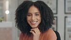 Face, smile and afro with a business woman at a desk in her office looking happy in her career. Portrait, positive mindset and mission with a confident young female employee sitting in the workplace