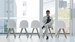 Waiting room, tablet and business man thinking of recruitment ideas, social media information and planning. Job decision, career solution and professional asian person on digital technology and chair