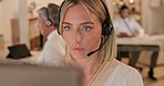 Call center, computer and woman in office for telemarketing, tech support and help desk. Contact us, customer service and sales agent, professional and serious consultant focus on deadline at night.