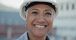 Portrait of woman in architecture with smile, helmet and job in project management at construction site. Safety, engineer and happy face of female contractor with confidence in building maintenance.