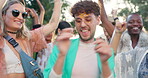 Dance, festival and party with man in crowd for celebration, concert and energy in nature. Freedom, community and music with people dancing in audience for gen z, social event and friends in outdoors