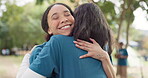 Camping, support and a counselor hugging a woman outdoor in nature together for love, trust or care. Summer, smile and happy friends embracing while bonding at a campsite in the forest or woods