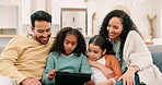 Parents, children and family with a tablet at home for education, learning or games. Multiracial man, woman and girl kids together in living room with tech and internet for streaming and development