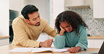 Education, motivation and a father talking to his daughter while using a notebook for learning or study. Homework, encourage or problem solving with a man and student girl in the kitchen of a home