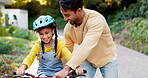 Father, kid and learning to ride bicycle in neighborhood at home for fun skill, childhood growth or support. Happy dad, cycling and teaching young girl on bike outdoor for trust, play and development